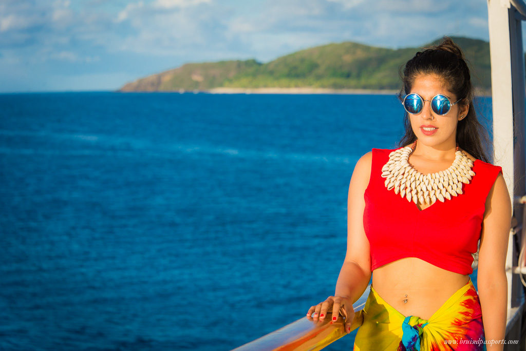 girl wearing Fijian sarong and shell-necklace for a cultural evening on board the captain cook cruise ship